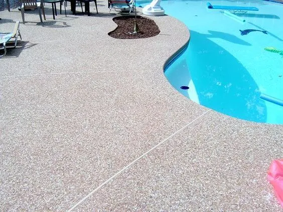 Pool Deck - Exposed aggregate concrete pool deck with natural stone texture and excellent traction